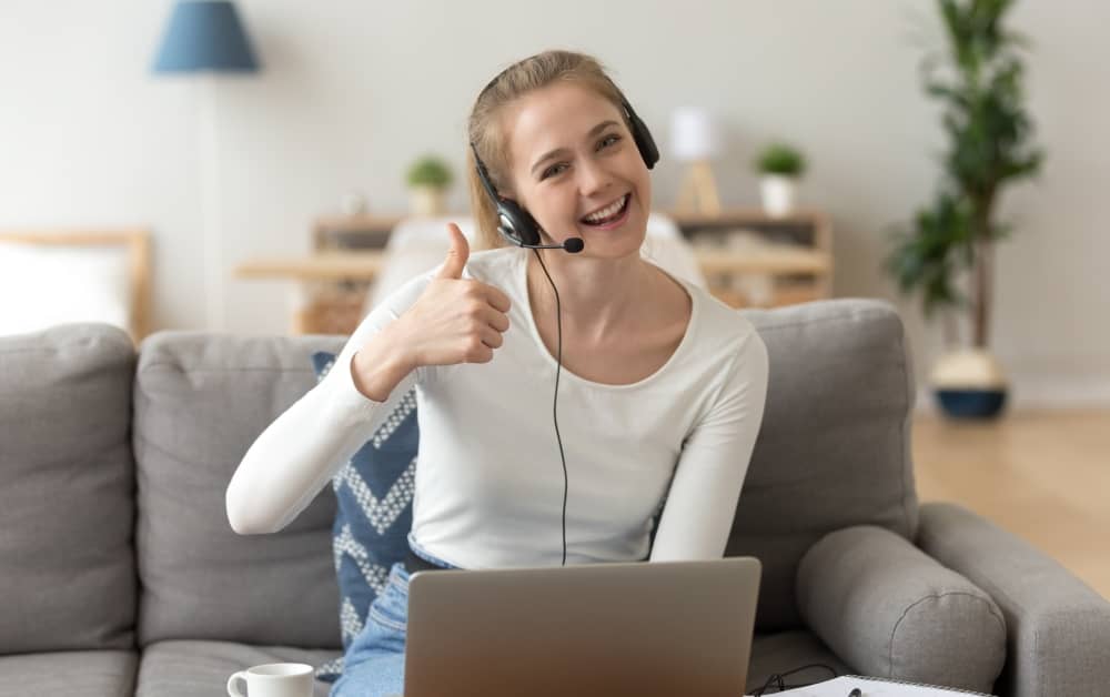 Smiling woman wearing headset, accent training.